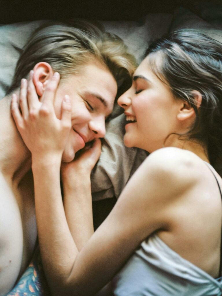 pexels-photo-414032-414032 A joyful and intimate moment of a young couple embracing and smiling together.